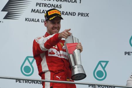 第2戦マレーシアGPで優勝し、喜ぶフェテル=Ferrari